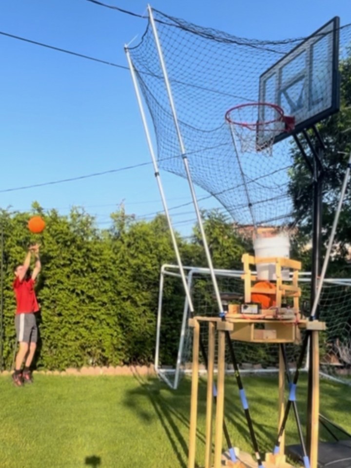 Taller basketball rebounder build with a hopper feeding balls back automatically